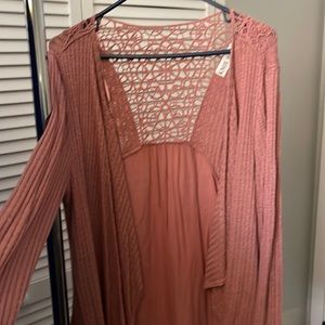 Rose pink cardigan sweater.